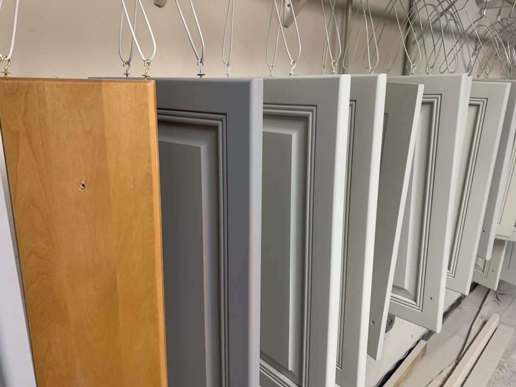 maple cabinets being painted white