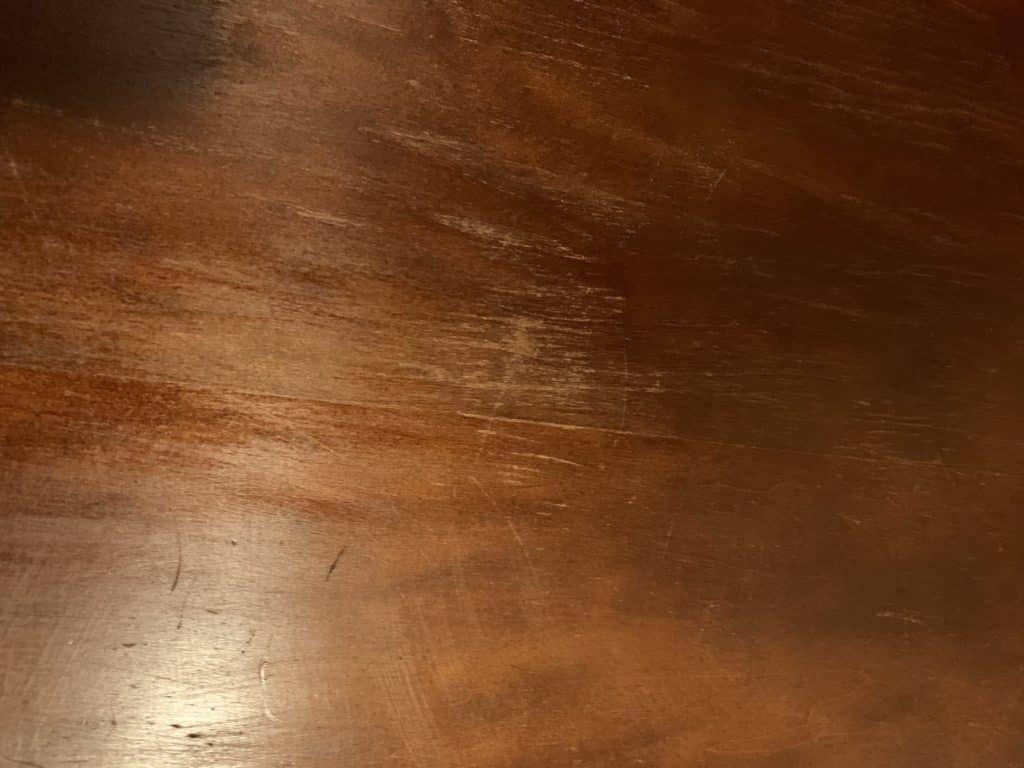 stain wearing away from wood