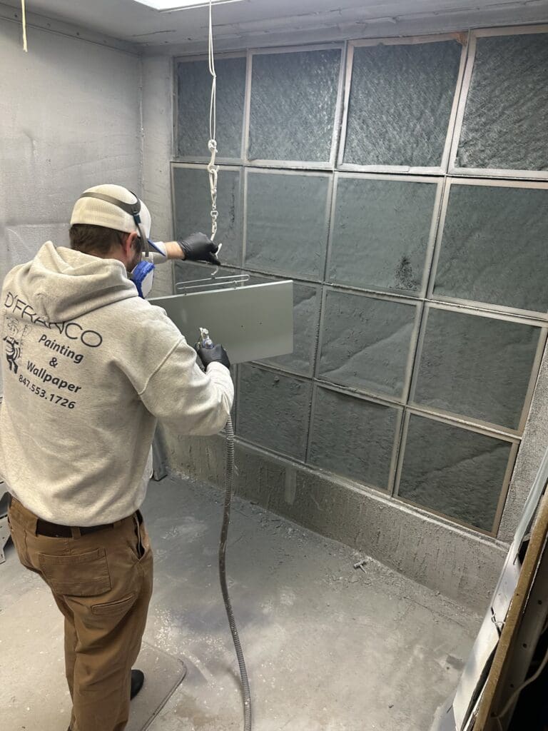 spraying kitchen cabinets