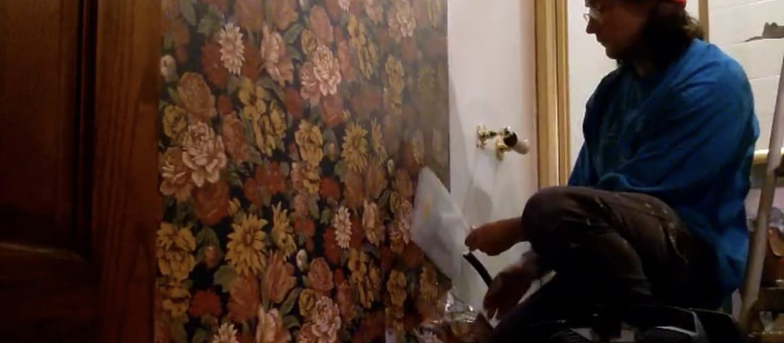 wallpaper being stripped from a bathroom